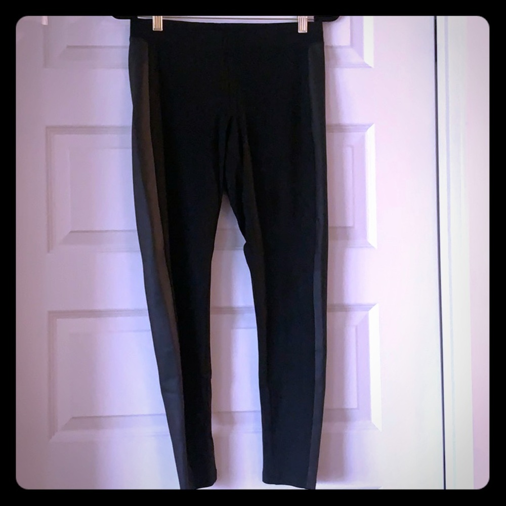 Black stretch pants with faux leather detail
